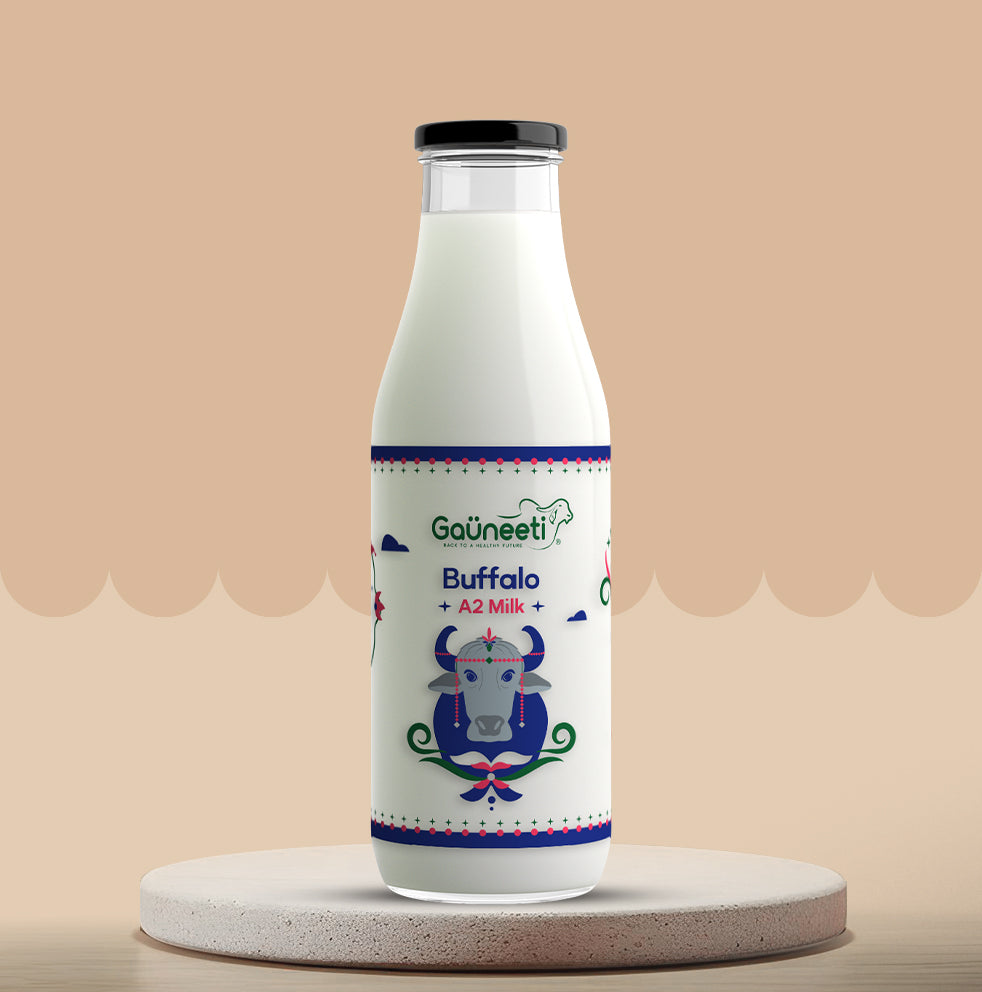 Bottle of Gauneeti Buffalo A2 Milk on a beige background.